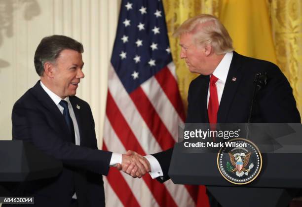 Colombian President Juan Manuel Santos and U.S. President Donald Trump shake hands during a joint news conference at the White House May 18, 2017 in...