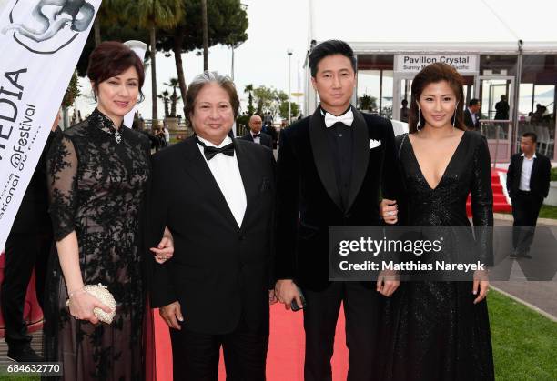 Joyce Godenzi, Sammo Hung, Timmy Hung and Janet Chow attend Sunny Media Cocktail during the 70th annual Cannes Film Festival at Grand Hotel on May...