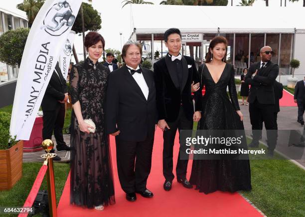 Joyce Godenzi, Sammo Hung, Timmy Hung and Janet Chow attend Sunny Media Cocktail during the 70th annual Cannes Film Festival at Grand Hotel on May...