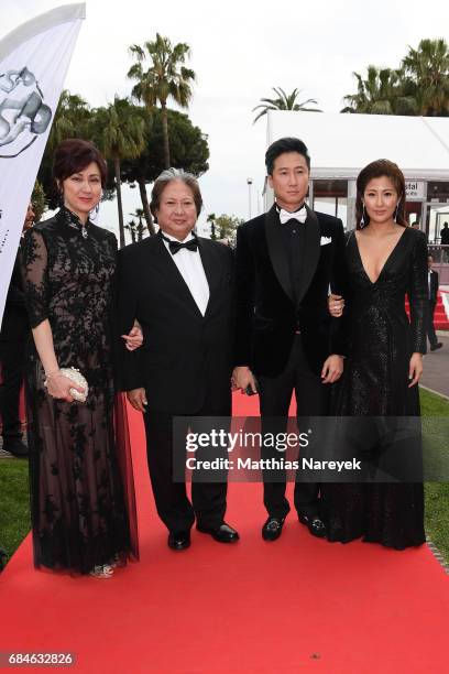 Joyce Godenzi, Sammo Hung, Timmy Hung and Janet Chow attend Sunny Media Cocktail during the 70th annual Cannes Film Festival at Grand Hotel on May...