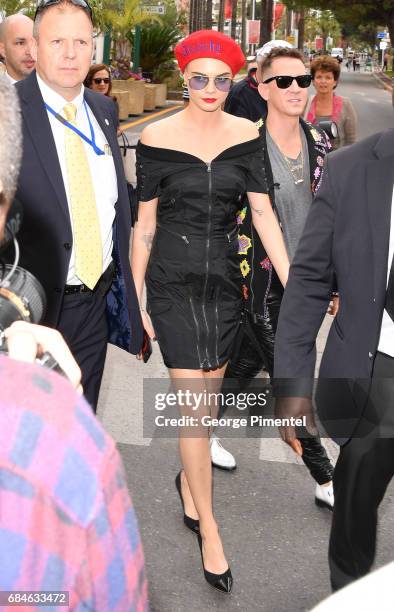 Cara Delevingne and designer Jeremy Scott are spotted as they arrives for the Magnum Ice Cream Press Conference during the 70th annual Cannes Film...