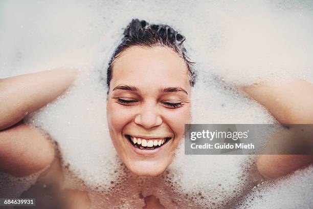 woman enjoying bath. - woman happy raised arms closed eyes stock pictures, royalty-free photos & images