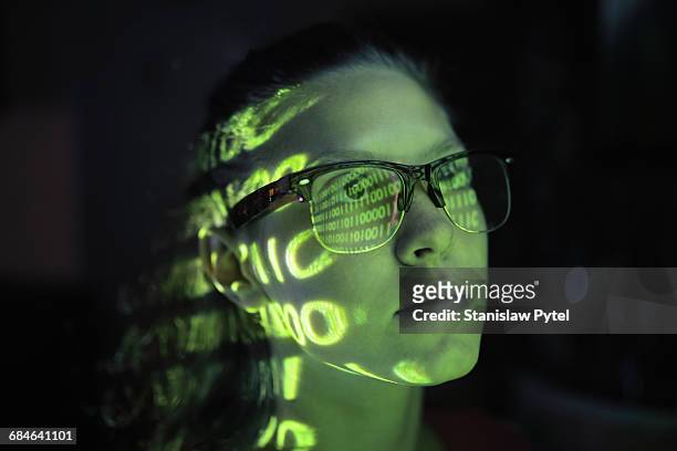 portrait of girl lighted with green numbers - development and coding stockfoto's en -beelden
