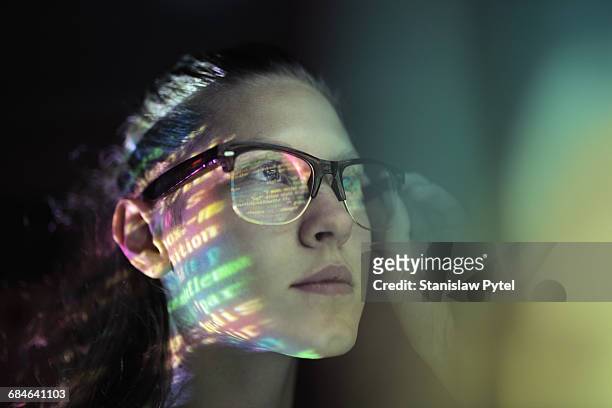 portrait, girl lighted with colorful code - tecnologia fotografías e imágenes de stock