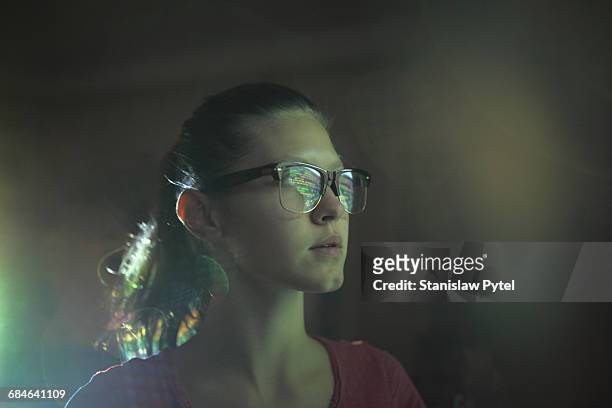 Portrait of girl, light bouncing on glasess