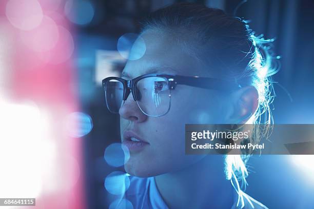 portrait of woman, blue light around - women in stem foto e immagini stock