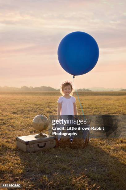 young girl with make believe hot air balloon - world war 1 aircraft stock-fotos und bilder
