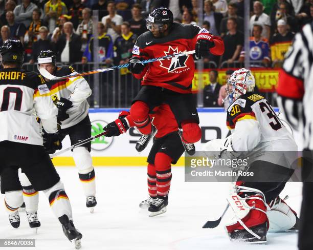 Wayne Simmonds of Canada flies high during the 2017 IIHF Ice Hockey World Championship Quarter Final game between Canada and Germany at Lanxess Arena...
