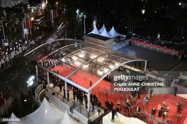 Guests arrive on May 18, 2017 for the screening of the film 'Blade of the Immortal' at the 70th edition of the Cannes Film Festival in Cannes,...