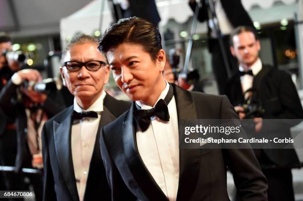 Director Takashi Miike and Takuya Kimura attend the "Blade Of The Immortal " premiere during the 70th annual Cannes Film Festival at Palais des...