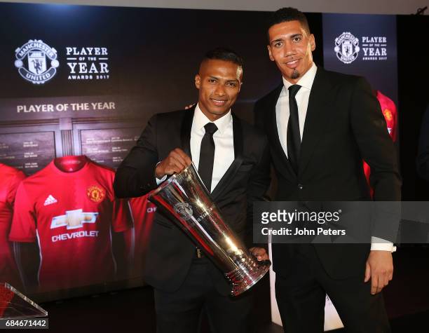 Antonio Valencia of Manchester United is presented with the Players' Player of the Year award by Chris Smalling at the club's annual Player of the...