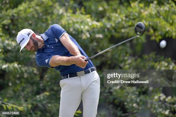 Dustin Johnson hits a shot on the 12th tee during Round One of the AT&T Byron Nelson at the TPC Four Seasons Resort Las Colinas on May 18, 2017 in...