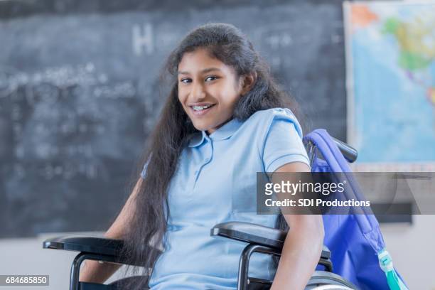 confident stem schoolgirl in wheelchair at school - special needs children stock pictures, royalty-free photos & images