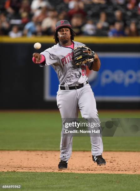 Gift Ngoepe of the Pittsburgh Pirates makes a running throw to first base against the Arizona Diamondbacks at Chase Field on May 13, 2017 in Phoenix,...