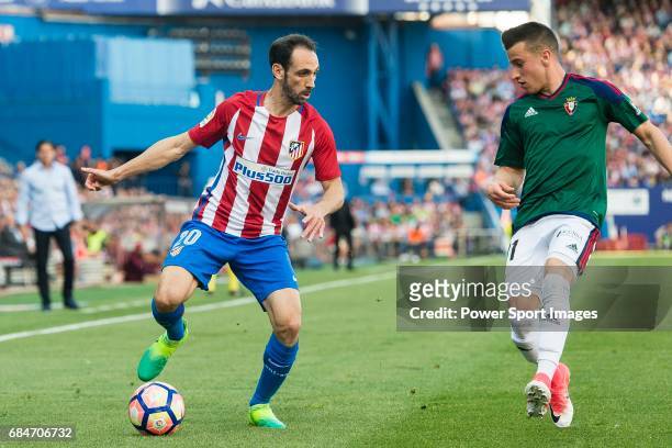 Juan Francisco Torres Belen, Juanfran, of Atletico de Madrid in action against Alex Berenguer Remiro of Osasuna during the La Liga match between...
