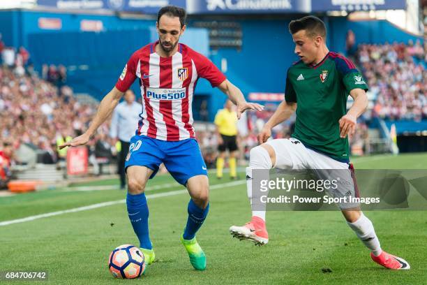 Juan Francisco Torres Belen, Juanfran, of Atletico de Madrid in action against Alex Berenguer Remiro of Osasuna during the La Liga match between...