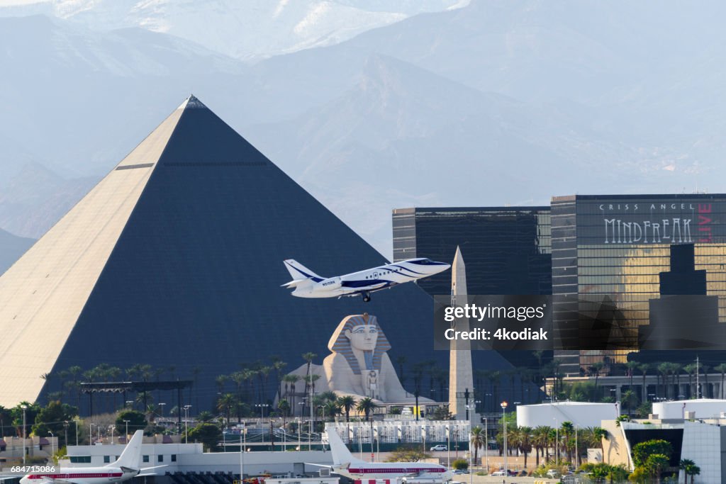 Las Vegas Hotel Casino Buildings with airplane taking off in the foreground