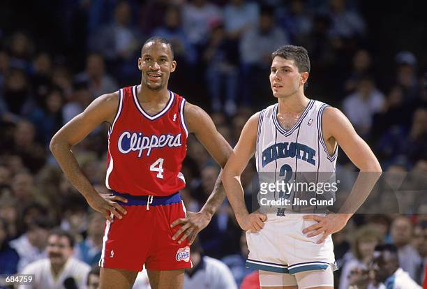 Ron Harper of the Los Angeles Clippers stands next to Rex Chapman of the Charlotte Hornets, during the NBA game. NOTE TO USER: User expressly...