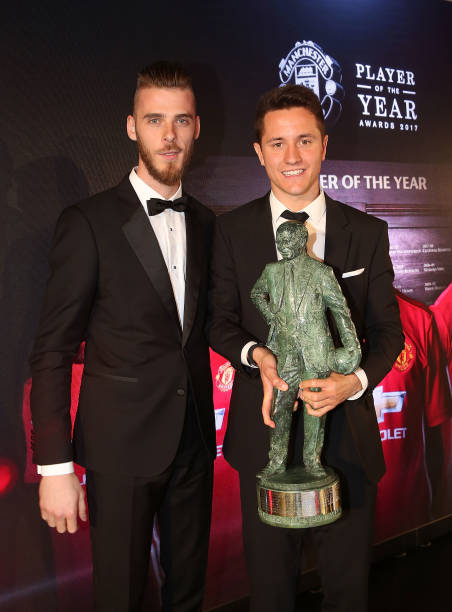 Ander Herrera of Manchester United is presented with the Sir Matt Busby Player of the Year award by David de Gea at the club's annual Player of the...