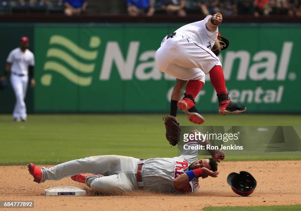Andres Blanco of the Philadelphia Phillies steals second base as Rougned Odor of the Texas Rangers leaps to avoid a collision during the seventh...