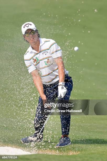 Ryo Ishikawa of Japan hits a bunker shot on the 11th hole during Round One of the AT&T Byron Nelson at the TPC Four Seasons Resort Las Colinas on May...