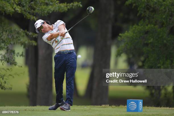 Ryo Ishikawa of Japan hits a shot on the 12th tee during Round One of the AT&T Byron Nelson at the TPC Four Seasons Resort Las Colinas on May 18,...
