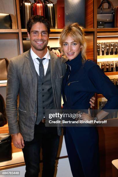 Actors Tom Leeb and Pauline Lefevre attend the Montblanc : Champs-Elysees Flagship Reopening on May 18, 2017 in Paris, France.