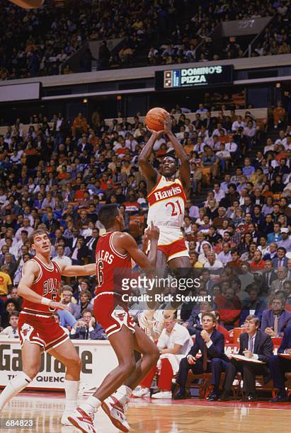 Dominique Wilkins of the Atlanta Hawks shoots the ball, during the NBA game against the Chicago Bulls at the Omni in Atlanta, Georgia on January 1,...