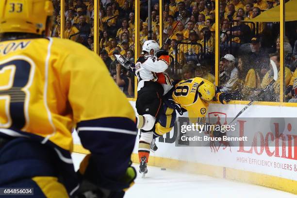 Kevin Bieksa of the Anaheim Ducks checks James Neal of the Nashville Predators during the first period in Game Four of the Western Conference Final...