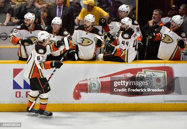 Rickard Rakell of the Anaheim Ducks celebrates with teammates after scoring a goal against Pekka Rinne of the Nashville Predators during the first...