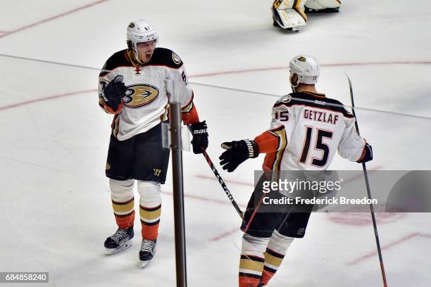 Rickard Rakell of the Anaheim Ducks celebrates with Ryan Getzlaf after scoring a goal against Pekka Rinne of the Nashville Predators during the first...