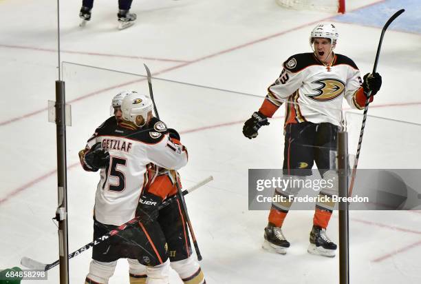 Rickard Rakell of the Anaheim Ducks celebrates with Ryan Getzlaf after scoring a goal against Pekka Rinne of the Nashville Predators as Jakob...