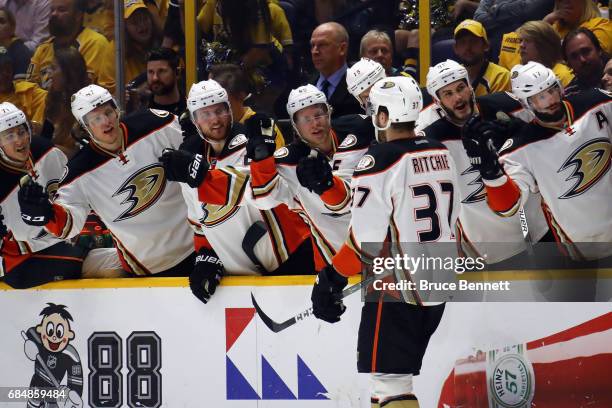 Nick Ritchie of the Anaheim Ducks celebrates with teammates after scoring a goal during the second period against Pekka Rinne of the Nashville...