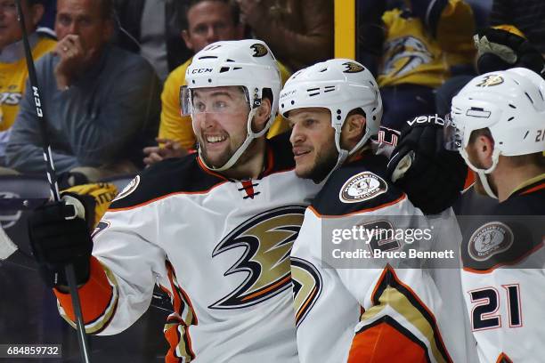 Nick Ritchie of the Anaheim Ducks celebrates with Kevin Bieksa and Chris Wagner after scoring a goal during the second period against Pekka Rinne of...