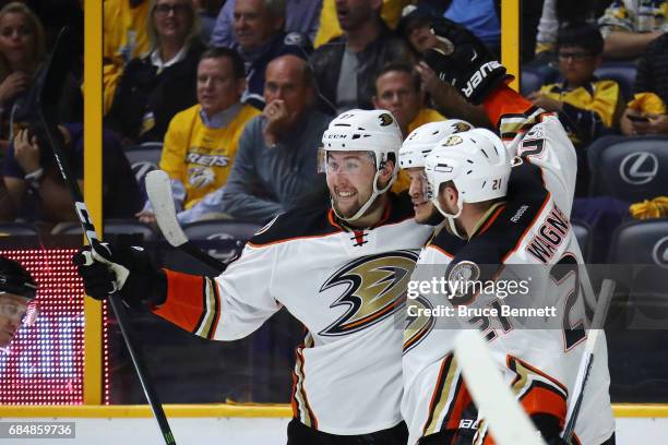 Nick Ritchie of the Anaheim Ducks celebrates with Kevin Bieksa and Chris Wagner after scoring a goal during the second period against Pekka Rinne of...