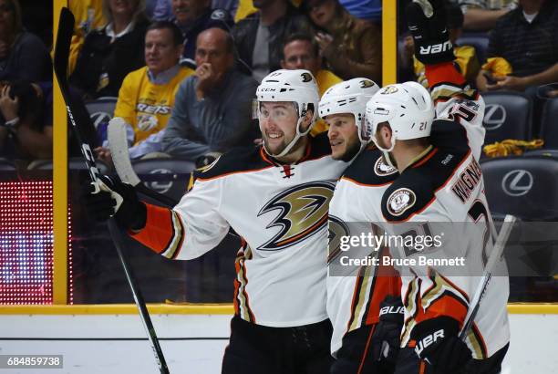 Nick Ritchie of the Anaheim Ducks celebrates with Kevin Bieksa and Chris Wagner after scoring a goal during the second period against Pekka Rinne of...