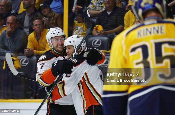 Nick Ritchie of the Anaheim Ducks celebrates with Kevin Bieksa after scoring a goal during the second period against Pekka Rinne of the Nashville...