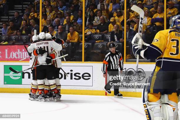 Nick Ritchie of the Anaheim Ducks celebrates with teammates after scoring a goal during the second period against Pekka Rinne of the Nashville...
