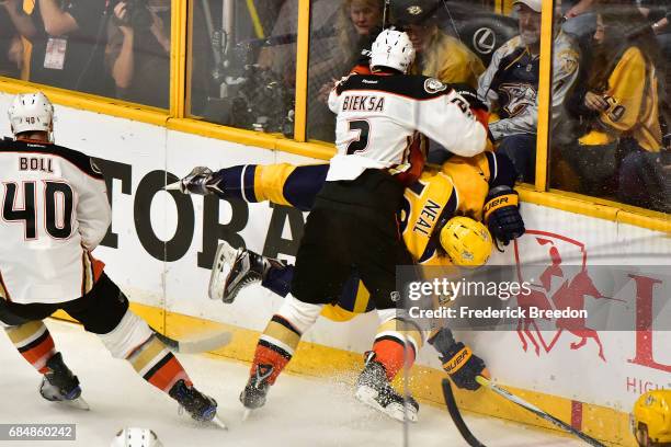 Kevin Bieksa of the Anaheim Ducks checks James Neal of the Nashville Predators during the first period in Game Four of the Western Conference Final...