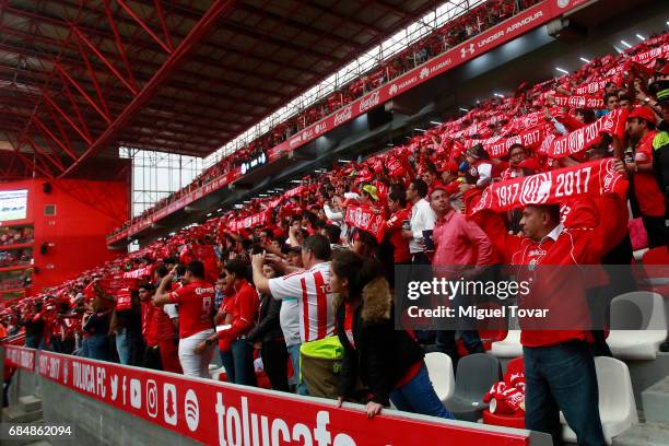 Fans of Toluca cheer for their team during the semifinals first leg match between Toluca and Chivas as part of the Torneo Clausura 2017 Liga MX at...