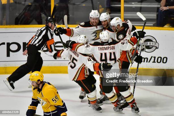 Nick Ritchie of the Anaheim Ducks celebrates with teammates after scoring a goal during the second period against Pekka Rinne of the Nashville...