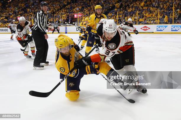 Yannick Weber of the Nashville Predators and Nick Ritchie of the Anaheim Ducks battle for position during the second period in Game Four of the...