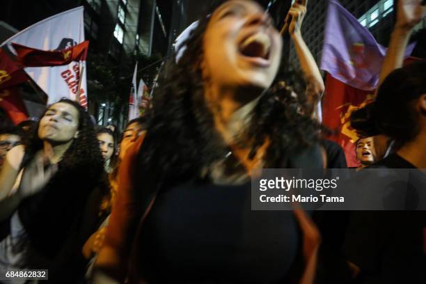 Demonstrators chant during an anti-Temer protest on May 18, 2017 in Rio de Janeiro, Brazil. Thousands of protestors hit the streets of Rio in the...