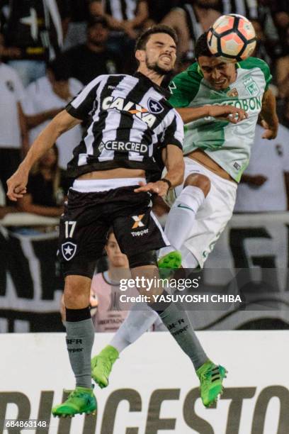 Daniel Bocanegra of Colombia's Atletico Nacional heads the ball with Rodrigo Pimpao of Brazil's Botafogo during their Copa Libertadores 2017 football...