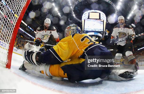 Pekka Rinne of the Nashville Predators makes a save against Ryan Kesler and Andrew Cogliano of the Anaheim Ducks during the second period in Game...