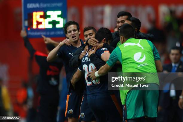 Rodolfo Pizarro of Chivas celebrates with teammates after scoring his team's first goal during the semifinals first leg match between Toluca and...