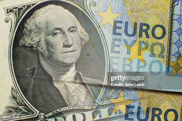 dollar and euro close-up - euro dollar stockfoto's en -beelden