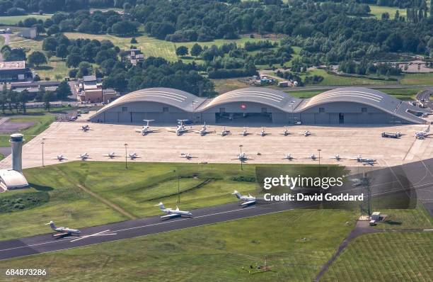 Aerial photograph of the Norman Foster Hangars at Farnborough Airport, formerly known as the Royal Aircraft Establishment. This former Ministry of...