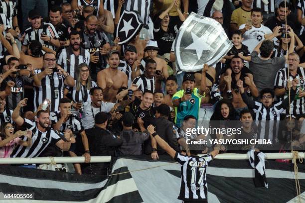 Rodrigo Pimpao of Brazil's Botafogo celebrates with fans their 1-0 win at the end of their 2017 Copa Libertadores football match against Colombia's...