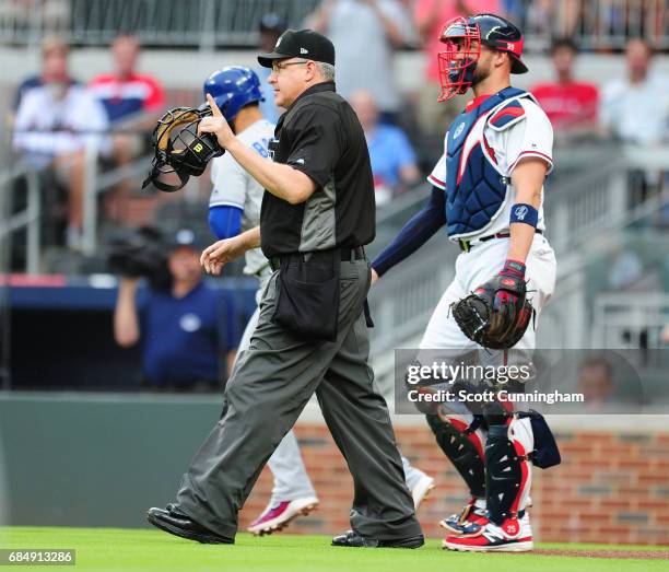 Home Plate Umpire Paul Emmel issues a warning to the Atlanta Braves after Julio Teheran , hit Jose Bautista of the Toronto Blue Jays with a first...